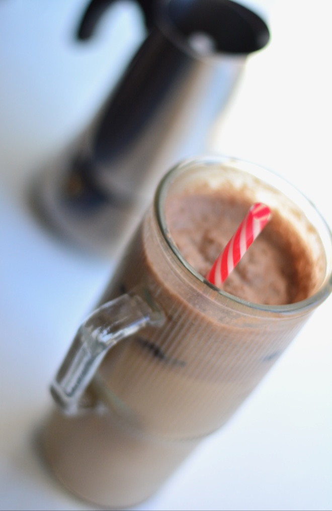 iced mocha peppermint latte with espresso machine in background