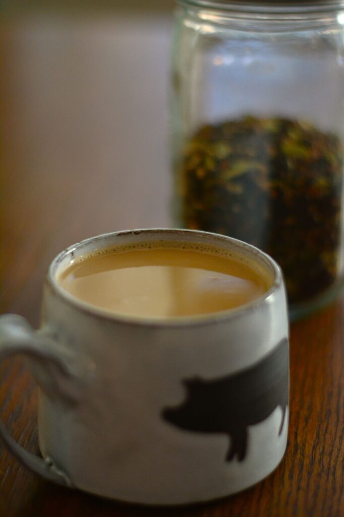 homemade chai latte in a mug, chai latte made with masala chai concentrate