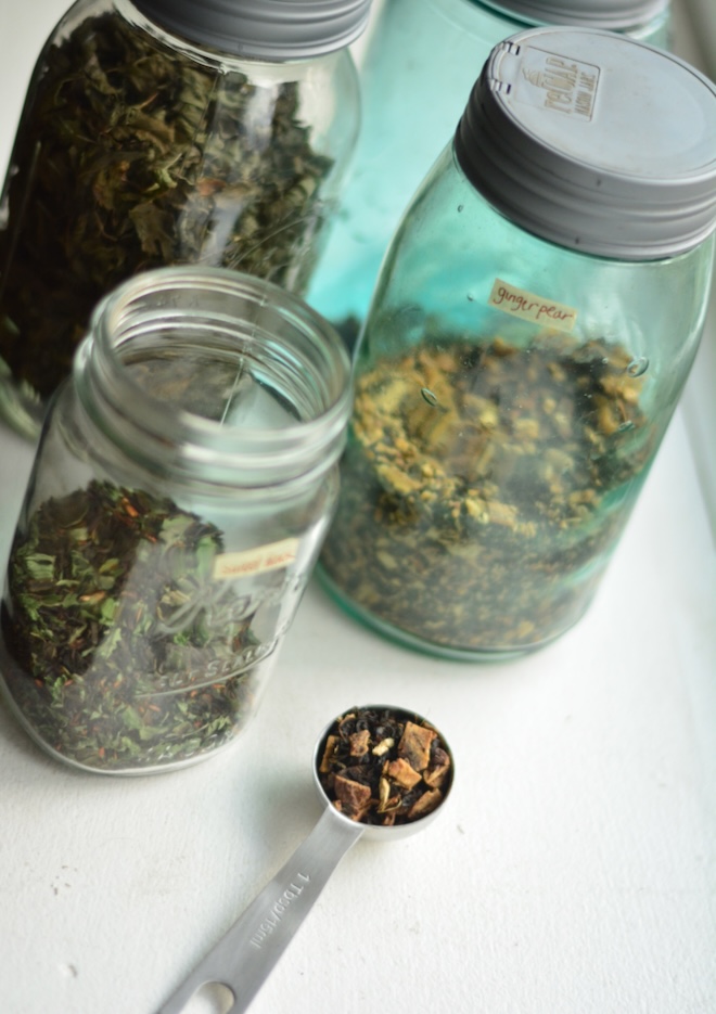 dried ginger and dried fruit and black loose leaf tea for making a tea blend