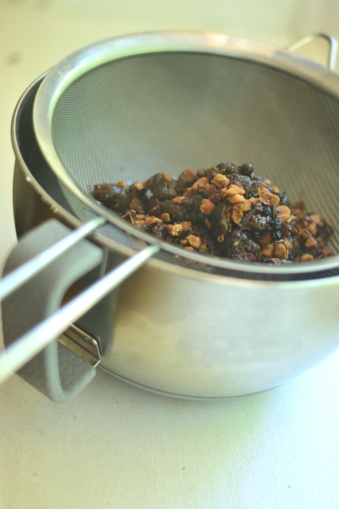 What's in Dr Pepper? Ingredients to make Dr Pepper homemade soda in a strainer to make soda syrup