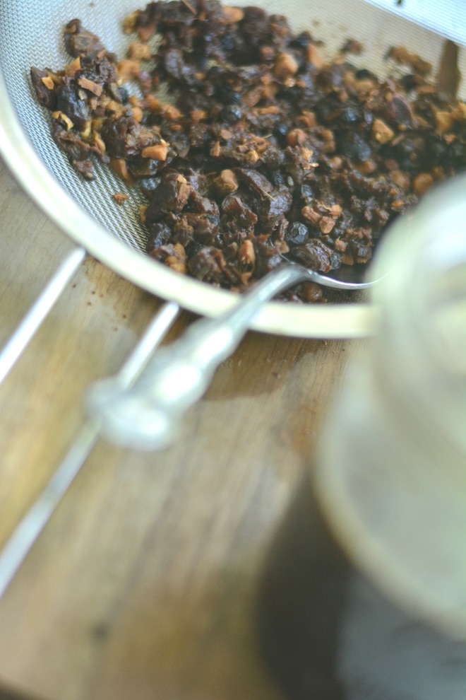 Strained herbs and spices ingredients for homemade Dr Pepper soda, can be used for Dr Pepper flavored kombucha