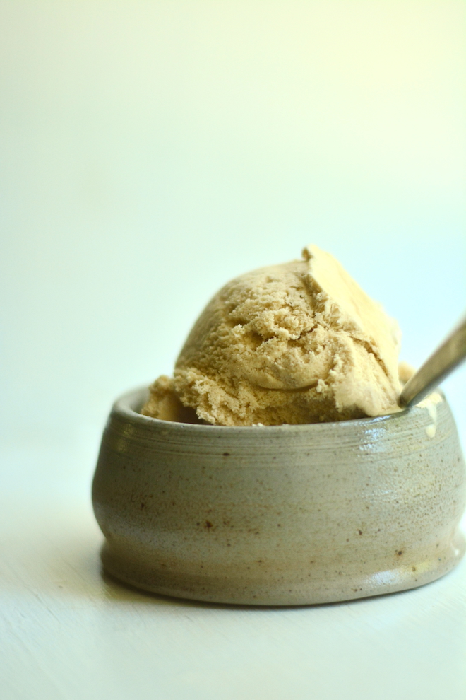 a spoon is propped in a bowl of homemade coffee ice cream