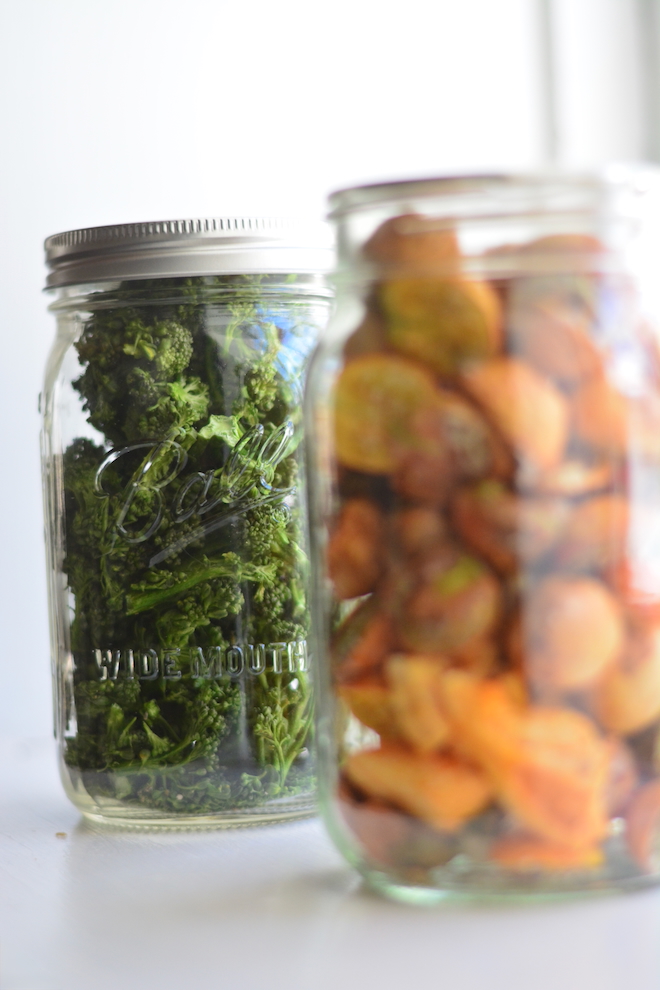 freeze dried vegetables, broccoli and cherry tomatoes, in mason jars