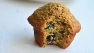 blueberry muffin made with fresh whole wheat flour with sugar on top