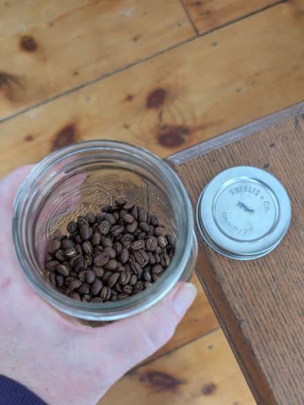 organic, regenerative coffee beans in a jar with lid